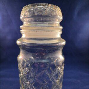 Vintage 1984 Planters Mr. Peanut quilted glass jar with lid.